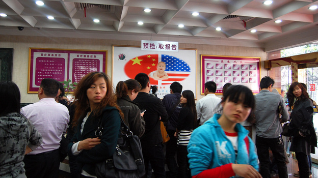 The lobby of the Shanghai Ji Ai Genetics and IVF Institute is filled with clients waiting to see doctors.