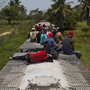 Migrants ride on top of a freight train in the Mexican state of Tabasco. They'll hop trains for days, possibly even weeks, before getting to the U.S. border. Migrants ride on top of a freight train in the Mexican state of Tabasco. They'll hop trains for days, possibly even weeks, before getting to the U.S. border.
