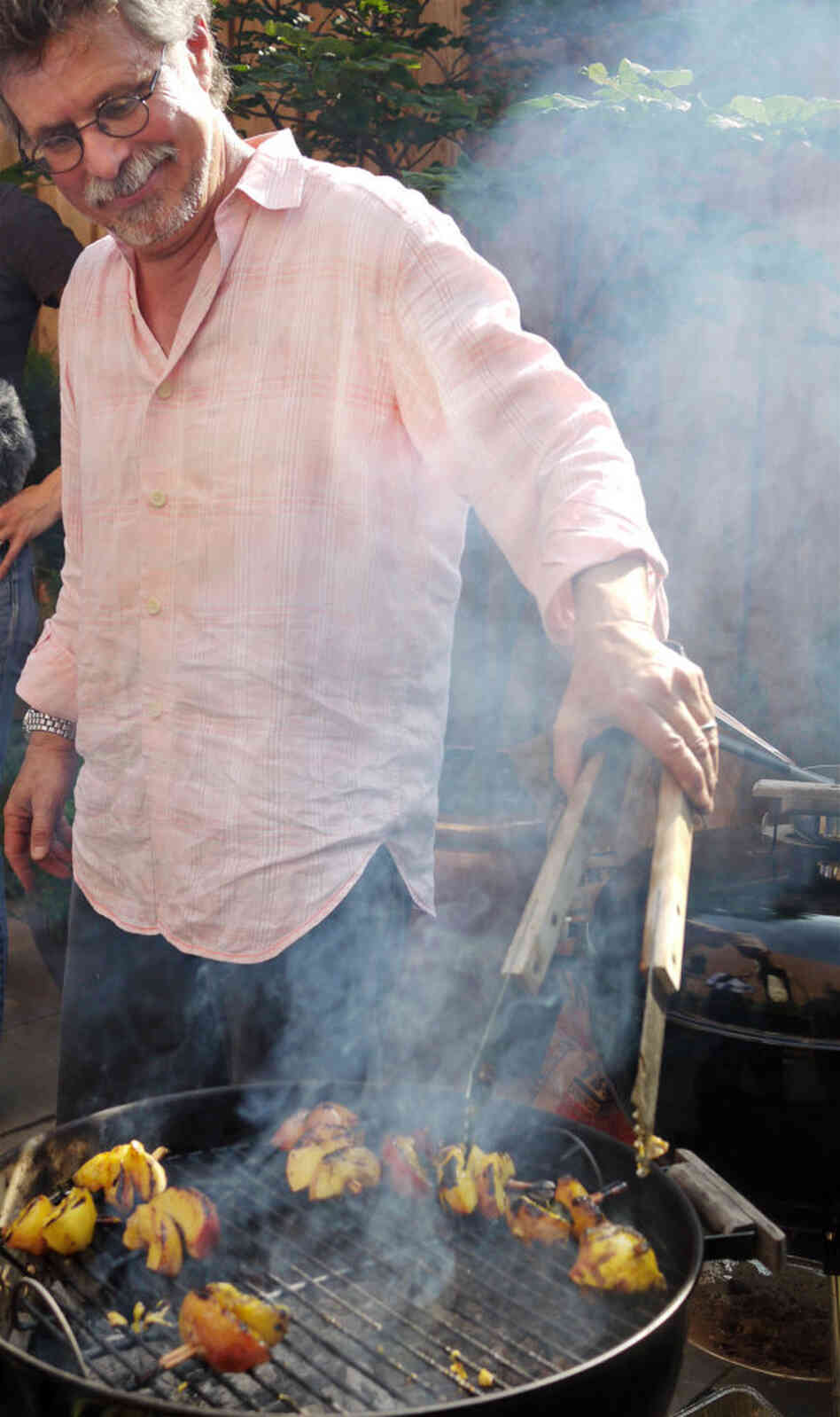 Raichlen grills peaches skewered on cinnamon sticks. Raichlen grills peaches skewered on cinnamon sticks.