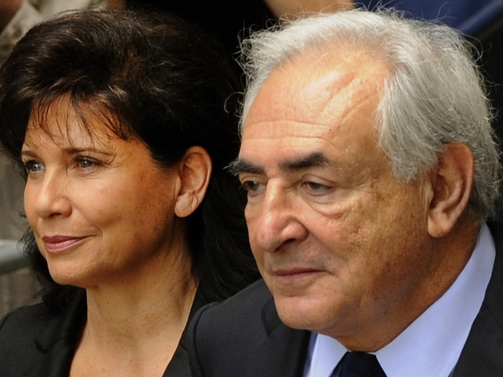 Dominique Strauss-Kahn, the former head of the International Monetary Fund, and his wife, Anne Sinclair, leave a Manhattan court on June 6.
