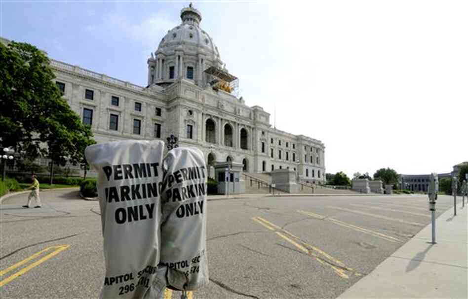 Lawmakers' parking spots were empty in front of the Minnesota State Capitol in St. Paul Friday. Lawmakers' parking spots were empty in front of the Minnesota State Capitol in St. Paul Friday.