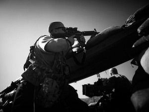 PFC Thomas Packer from Tama, Iowa, looks through the scope on his rifle as incoming mortar rounds hit just outside the bunker at Combat Outpost Wilderness in Paktia province. PFC Thomas Packer from Tama, Iowa, looks through the scope on his rifle as incoming mortar rounds hit just outside the bunker at Combat Outpost Wilderness in Paktia province.