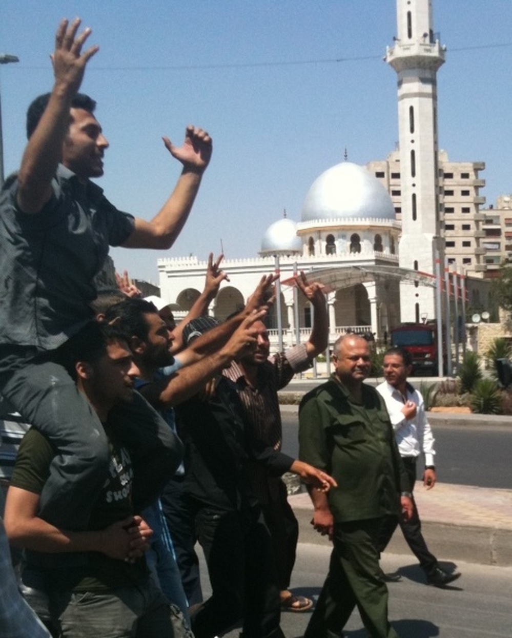 Protesters march in the streets of Damascus on Friday.