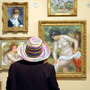 A visitor looks at paintings at the Barnes Foundation in Lower Merion, Pa. The art collection is moving to a new building in downtown Philadelphia.