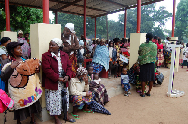 Women wait outside the maternal-child health clinic in Macia. Women who come to the clinic for prenatal care will automatically be tested for HIV.