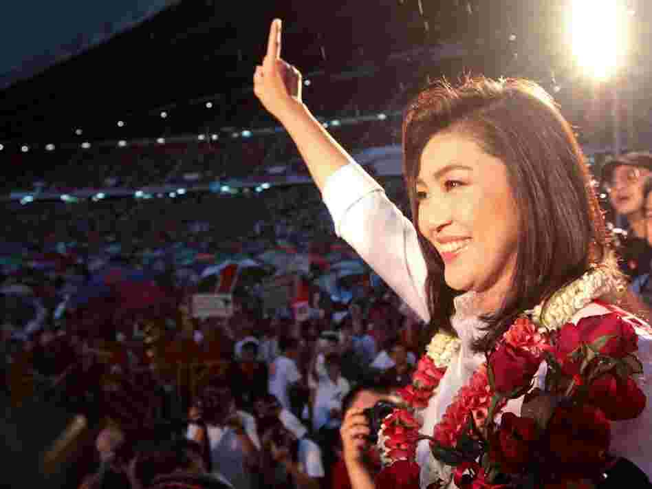 Yingluck gestures to her supporters during an election campaign at Rajamangala stadium in Bangkok on Friday.