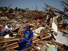 April 30, 2011: In Tuscaloosa, Ala., LaTia Cobbs sat in the rubble of her destroyed home following the massive tornado that swept through the city three days earlier. April 30, 2011: In Tuscaloosa, Ala., LaTia Cobbs sat in the rubble of her destroyed home following the massive tornado that swept through the city three days earlier.