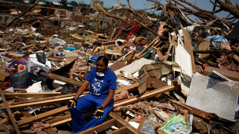 April 30, 2011: In Tuscaloosa, Ala., LaTia Cobbs sat in the rubble of her destroyed home following the massive tornado that swept through the city three days earlier.