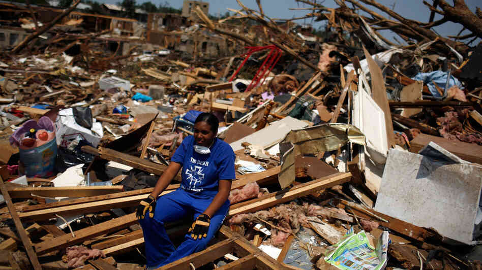 April 30, 2011: In Tuscaloosa, Ala., LaTia Cobbs sat in the rubble of her destroyed home following the massive tornado that swept through the city three days earlier.