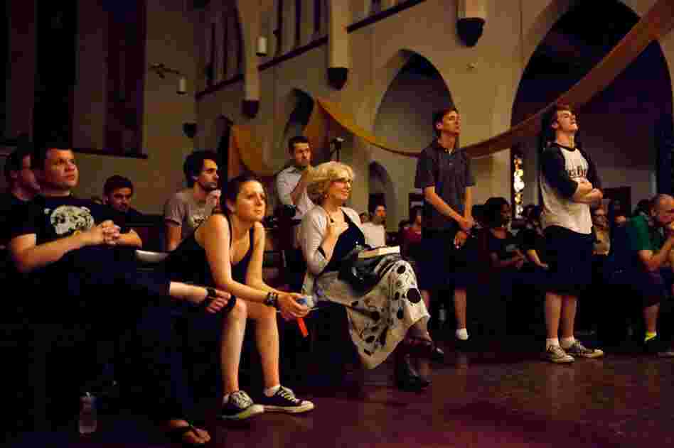 Jenufa Kent (center, hand on chest) of Vienna, Va., watches her daughter, Natalja, perform with the choir.