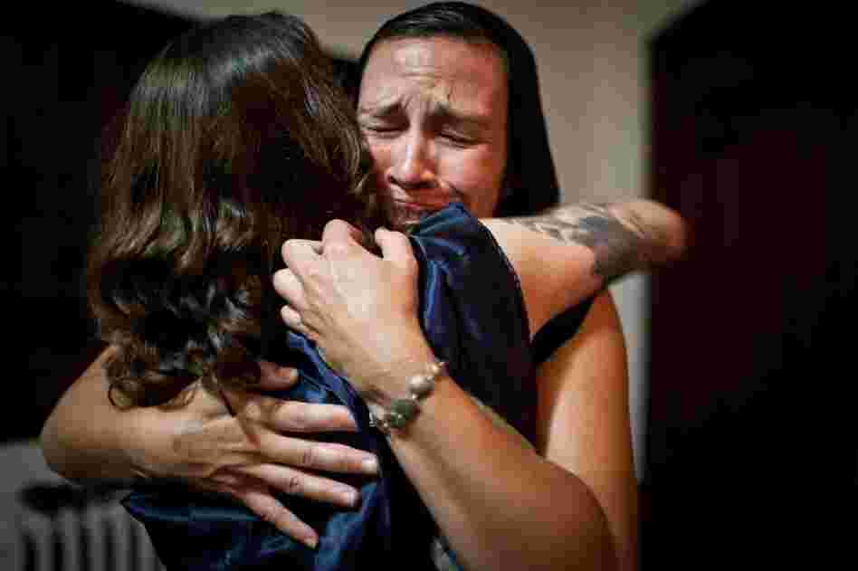 Caitlin Johnston of Providence, R.I., hugs Wolpert after their performance.