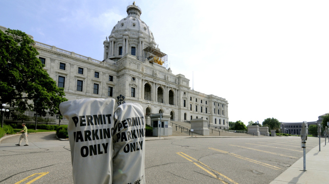 Lawmakers' parking spots were empty in front of the Minnesota Capitol in St. Paul on Friday.
