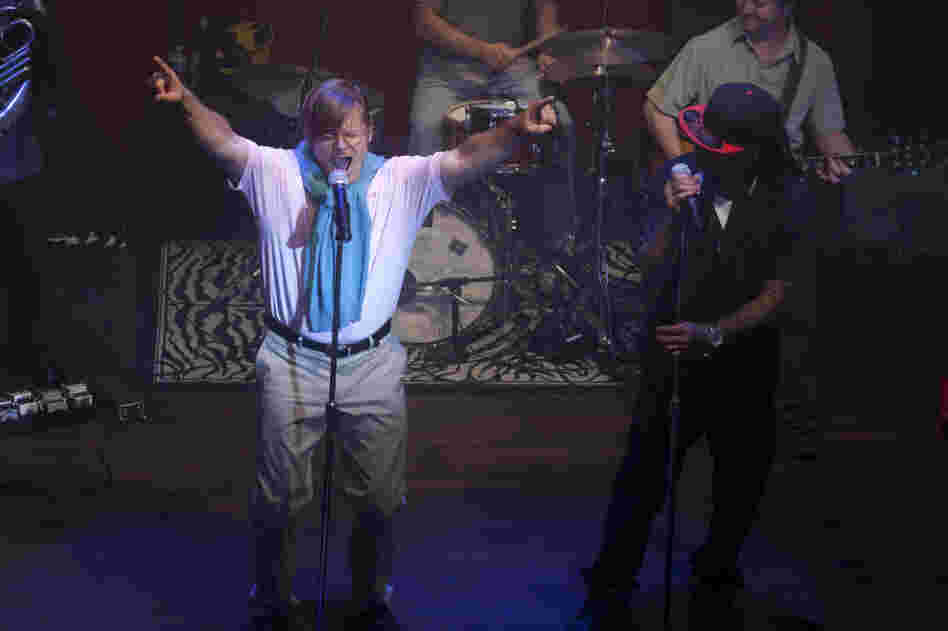 DJ Davis (Steve Zahn) relinquishes leadership of the Brassy Knoll in style, while Lil Calliope (Altonio "Ace B" Jackson) watches on, in Treme. DJ Davis (Steve Zahn) relinquishes leadership of the Brassy Knoll in style, while Lil Calliope (Altonio "Ace B" Jackson) watches on, in Treme.