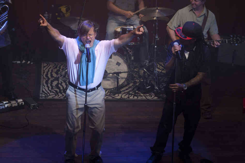 DJ Davis (Steve Zahn) relinquishes leadership of the Brassy Knoll in style, while Lil Calliope (Altonio "Ace B" Jackson) watches on, in Treme. DJ Davis (Steve Zahn) relinquishes leadership of the Brassy Knoll in style, while Lil Calliope (Altonio "Ace B" Jackson) watches on, in Treme.