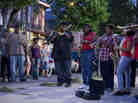 Antoine Batiste (Wendell Pierce) leads his students on a busking adventure in the French Quarter on Treme.