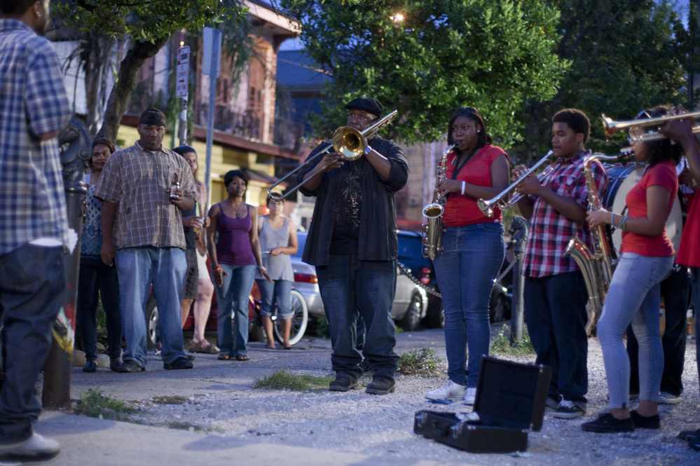 Antoine Batiste (Wendell Pierce) leads his students on a busking adventure in the French Quarter on Treme.