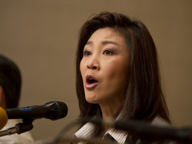 Yingluck  Shinawatra speaks to the media the  day after her party won an overwhelming victory in Sunday's national  election. The party  is loyal to Yingluck's brother former Prime Minister Thaksin  Shinawatra.
