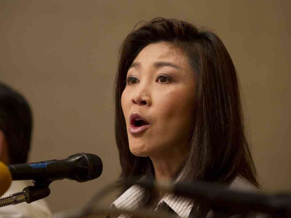 Yingluck  Shinawatra speaks to the media the  day after her party won an overwhelming victory in Sunday's national  election. The party  is loyal to Yingluck's brother former Prime Minister Thaksin  Shinawatra.