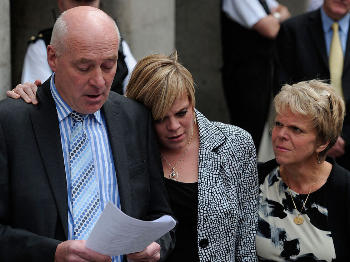Bob Dowler, father of murdered schoolgirl Amanda (Milly) Dowler, reads a statement outside the  Old Bailey in central London on June 24. With him are Milly's mother, Sally (right), and sister, Gemma.