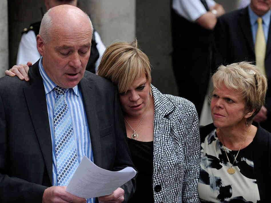 Bob Dowler, father of murdered schoolgirl Amanda (Milly) Dowler, reads a statement outside the  Old Bailey in central London on June 24. With him are Milly's mother, Sally (right), and sister, Gemma.