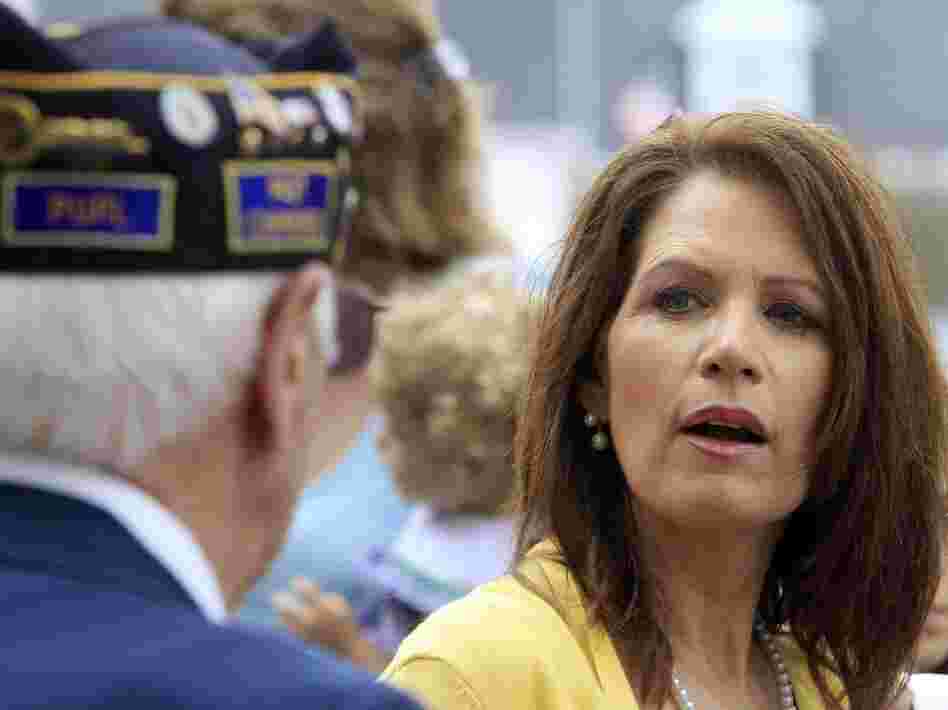 Meet And Greet: Rep. Michele Bachmann talks with veterans after marching in a Memorial Day parade in North Hampton, N.H.