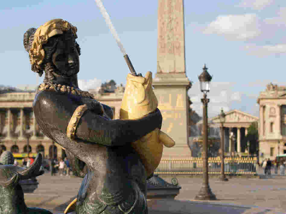 Mermaid sculpture in a fountain at Place de la Concorde in Paris.