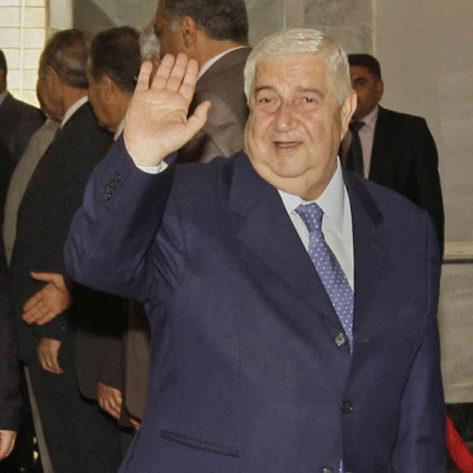 Syrian Foreign Minister Walid Moallem waves to reporters before a meeting with his counterpart from Iraq, in Baghdad on May 31, 2011. Syrian Foreign Minister Walid Moallem waves to reporters before a meeting with his counterpart from Iraq, in Baghdad on May 31, 2011.