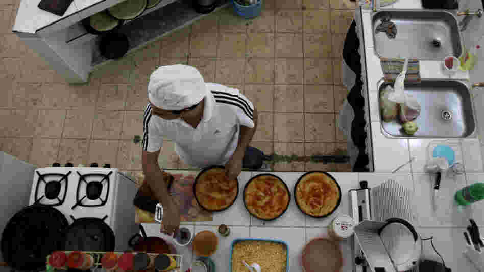 Julio Cesar Hidalgo prepares pizza in the restaurant run out of his home in Havana. The  Cuban government has given out more than 300,000 new self-employment  licenses in the past eight months.