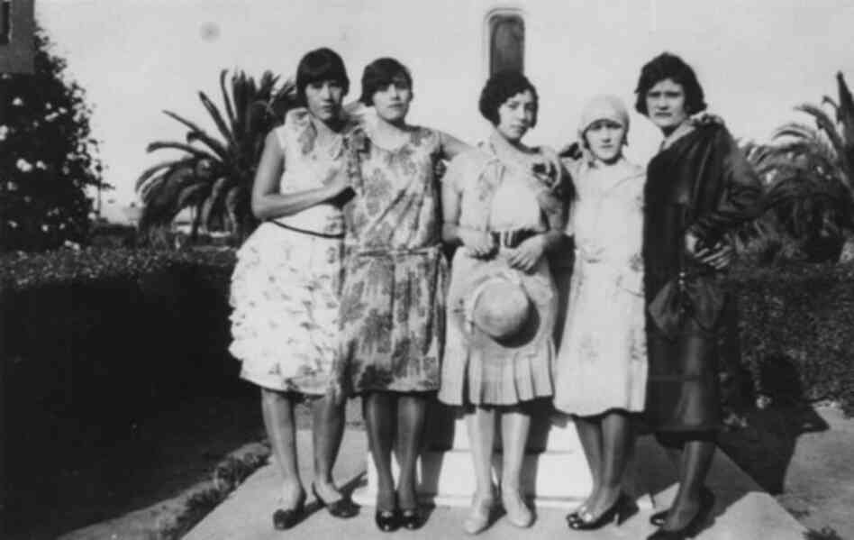 A group of Mexican-American flappers stand in a Southern California park in 1925.