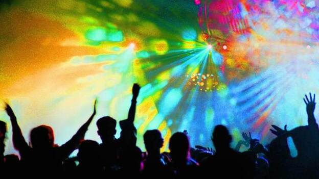 This is a photo tagged rave, club scene, light show and dance, circa 1990.
