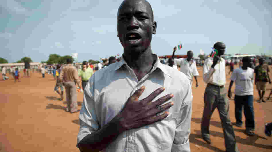 A South Sudanese man sings the new national anthem. In the recording below, students at Juba Commercial Secondary  School perform the song.
