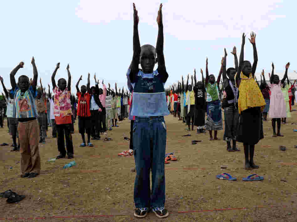 A handout picture released by the United Nations Mission in Sudan shows South Sudanese children rehearsing their dance routine to be performed at half time during a football match as part of independence day celebrations in Juba on Thursday, two days before South Sudan secedes from the north and becomes the world's newest nation.