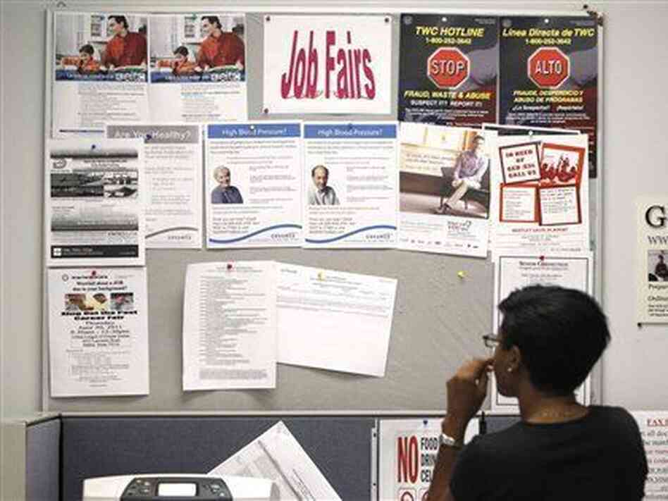 A job seeker looks at a bulletin at the Texas Workforce Commission's Workforce Solutions of Greater Dallas job resource center in Richardson, Texas, Tuesday, July 5, 2011. A job seeker looks at a bulletin at the Texas Workforce Commission's Workforce Solutions of Greater Dallas job resource center in Richardson, Texas, Tuesday, July 5, 2011.