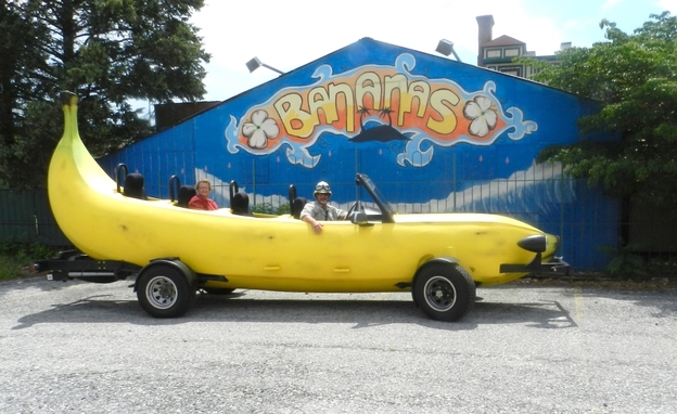 Steve Braithwaite sits in the driver's seat of his Big Banana Car in front of a closed nightclub in Allentown, Pa.
