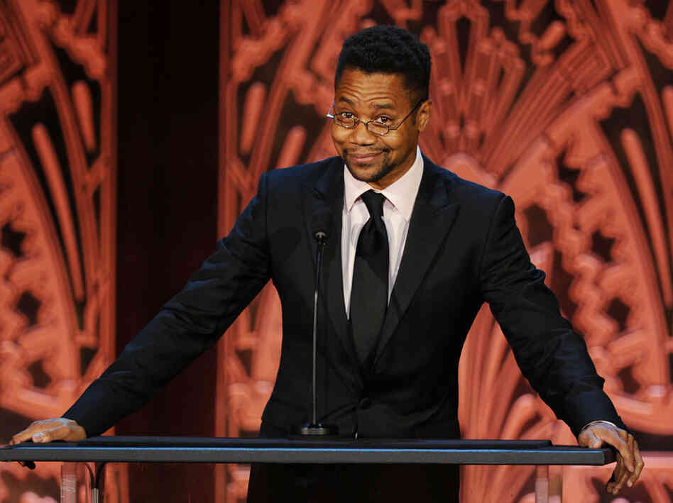 Gooding honors actor Morgan Freeman at an AFI tribute in June. Next year he'll star in Red Tails, a film about the Tuskegee Airmen. In 1995, he appeared in a made-for-TV movie on the same subject. Credit: Kevin Winter/Getty Images
