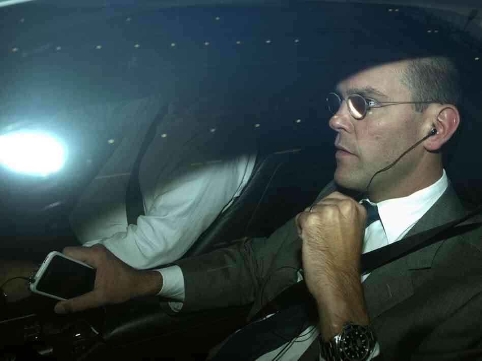 James Murdoch, chairman and chief executive of News Corp. Europe and Asia, is driven away from the offices of News International in London on Thursday. Murdoch announced that the company is folding Britain's best-selling tabloid News of the World amid a phone-hacking scandal. The 168-year-old weekly newspaper will publish its last edition Sunday.