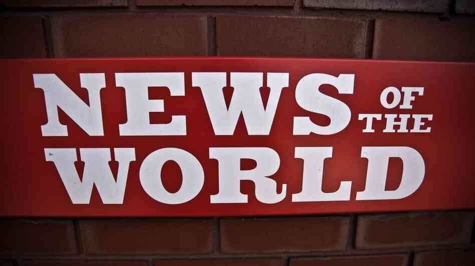 A News of the World sign is posted by an entrance of its parent company in London. News Corp. executive James Murdoch announced Thursday that News of the World will publish its last issue Sunday. A phone-hacking scandal has cost the weekly paper prestige and prompted dozens of companies to pull their ads.
