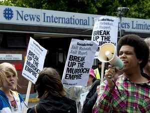 Demonstrators protest outside the headquarters of News International in London on Friday as Prime Minister David Cameron promised inquiries into a phone hacking scandal. Demonstrators protest outside the headquarters of News International in London on Friday as Prime Minister David Cameron promised inquiries into a phone hacking scandal.