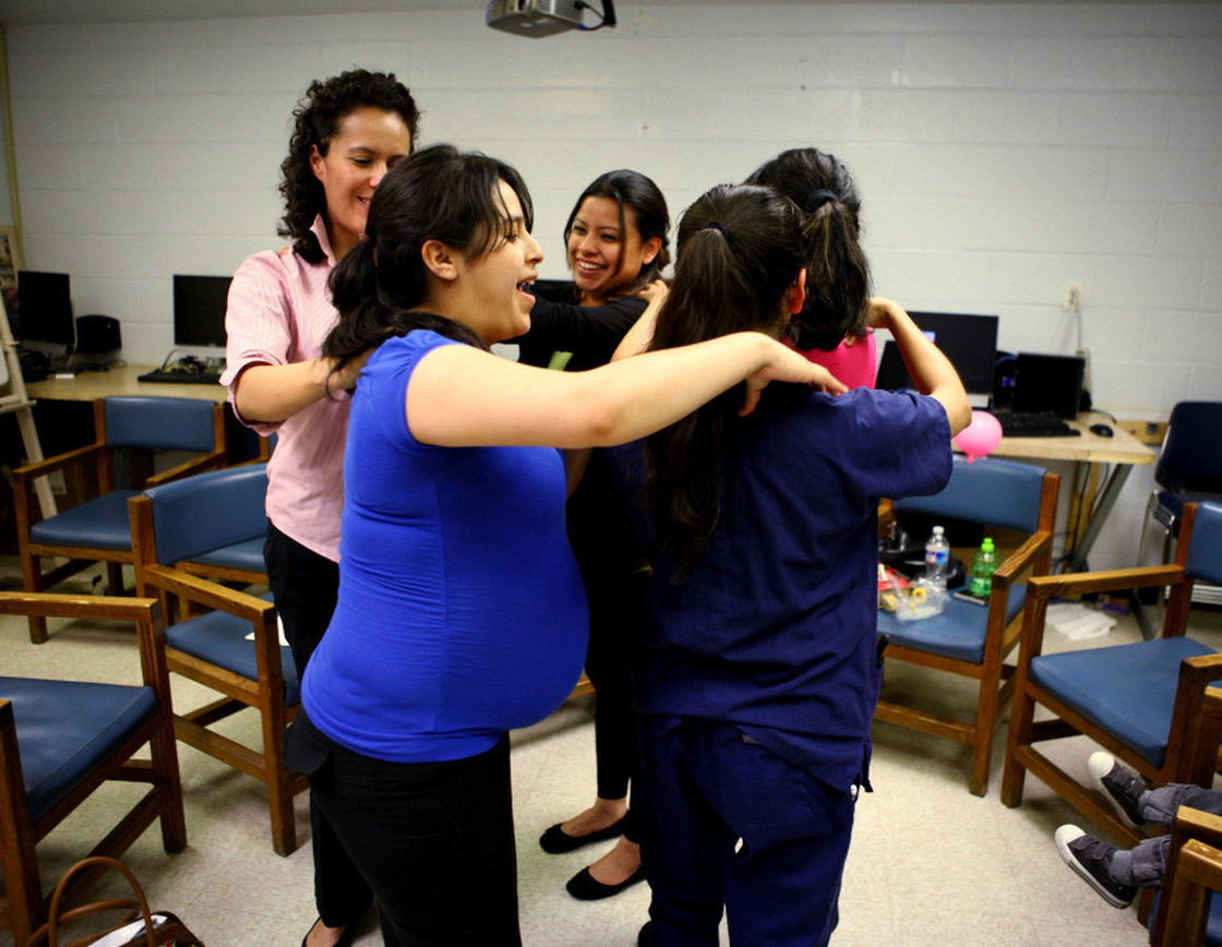 Members of the group give each other a back massage during the class. The woman who created the centering model, Sharon Schindler Rising, says "there's tremendous power in the group."