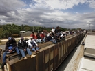 Migrants ride on top of a northern bound train toward the U.S.-Mexico border in Oaxaca, southern Mexico, in March. Migrants crossing Mexico to get to the U.S. have increasingly become targets of criminal gangs who kidnap them to obtain ransom money. Migrants ride on top of a northern bound train toward the U.S.-Mexico border in Oaxaca, southern Mexico, in March. Migrants crossing Mexico to get to the U.S. have increasingly become targets of criminal gangs who kidnap them to obtain ransom money.