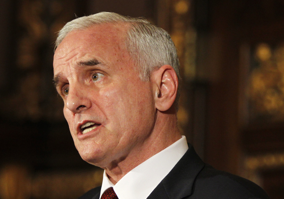 Gov. Mark Dayton speaks during a news conference hours before the government shut down.