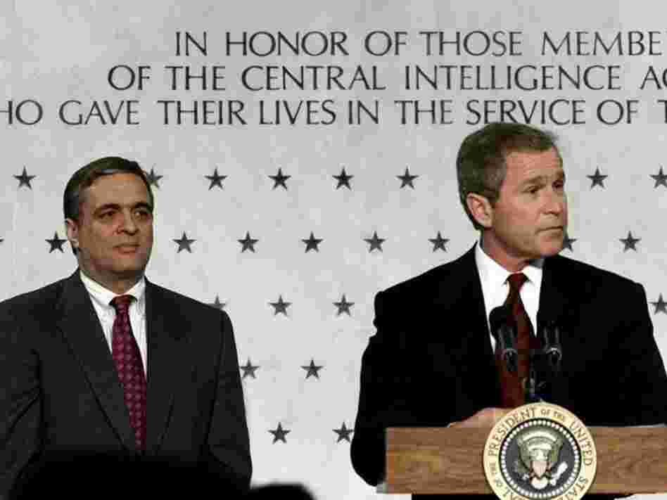 President Bush (right) addresses employees of the Central Intelligence Agency as CIA director George J. Tenet looks on in March 2001.  Under Tenet's leadership, the CIA would develop its role in the war on terrorism after the September 11, 2001, attacks.
