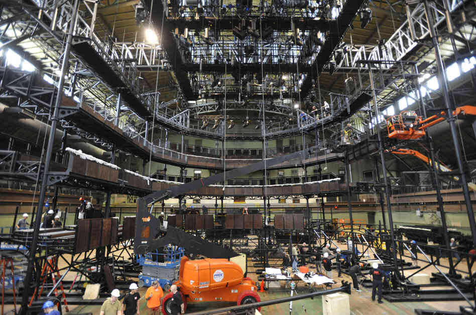 Inside the Park Avenue Armory in New York City, a construction crew assembles a replica — moved to New York in 46 shipping containers — of the Royal Shakespeare Company's main theater in Stratford-Upon-Avon.