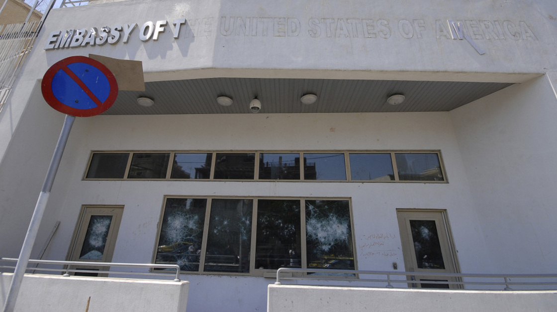 The damaged front side of the U.S. embassy is seen after pro-government protesters attacked the embassy compound in Damascus, Syria.