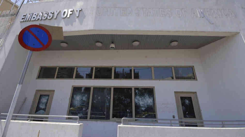 The damaged front side of the U.S. embassy is seen after pro-government protesters attacked the embassy compound in Damascus, Syria.