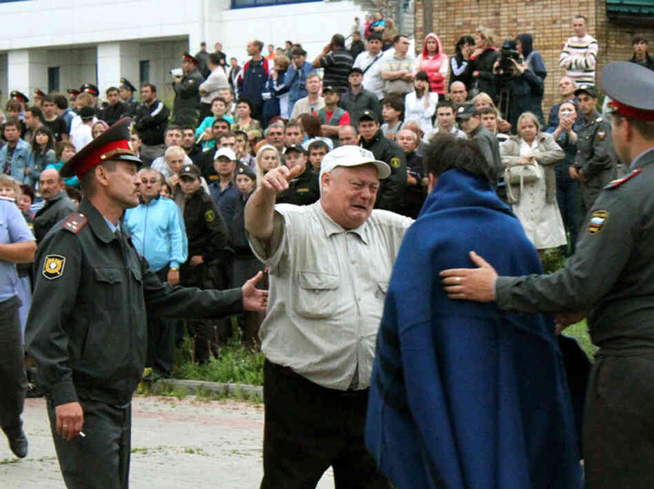 A handout photo provided Monday by Russia's Republic of Tatarstan Emergencies Ministry shows a relative on Sunday greeting a survivor of the Bulgaria cruise ship that sank on the Volga River east of Moscow.