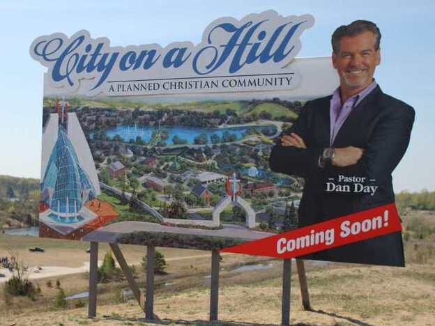 With accent fluctuating, Pierce Brosnan plays Pastor Dan Day of the Church of the Third Millenium, who plans to build his own Christian community out in the desert.