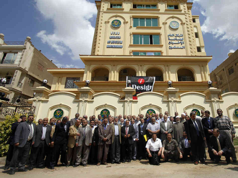 Egyptian Muslim Brotherhood Shura council members gather outside the new Muslim Brotherhood headquarters in Cairo on April 30.