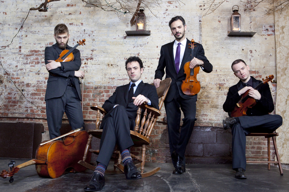 Brooklyn Rider, immersed in the music of Philip Glass.
