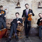Brooklyn Rider, immersed in the music of Philip Glass.